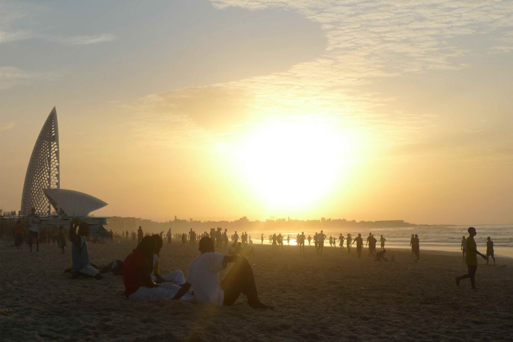 Sunset view of the Gorèè Memorial from the beach in Dakar, Senegal